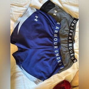 Two pair of like-new Under Armour running shorts. Size Medium.
